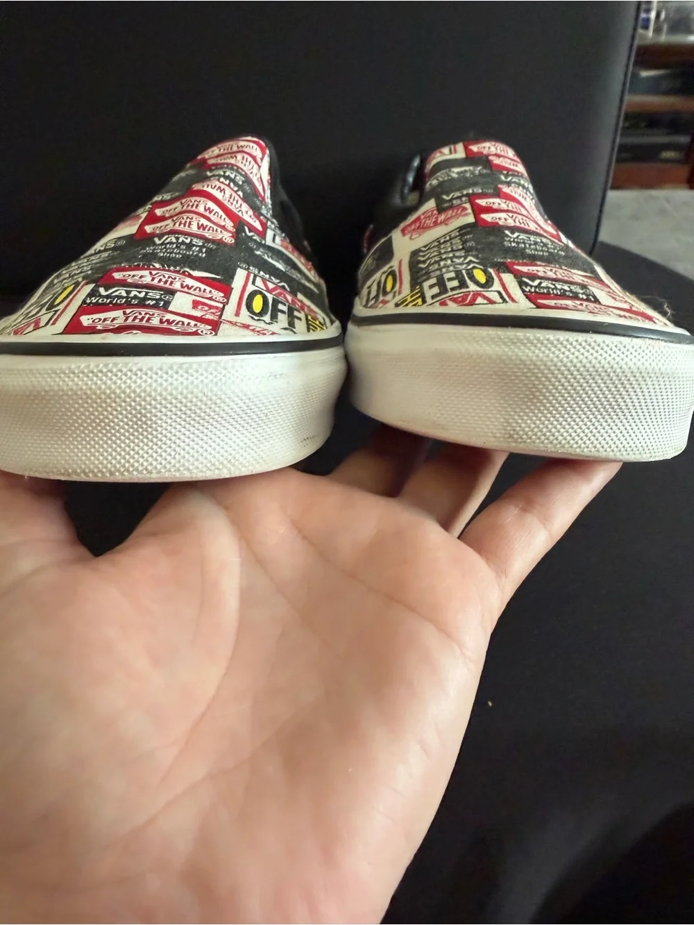 Vans Slip-On Sneakers in Black, White & Red Logo Print